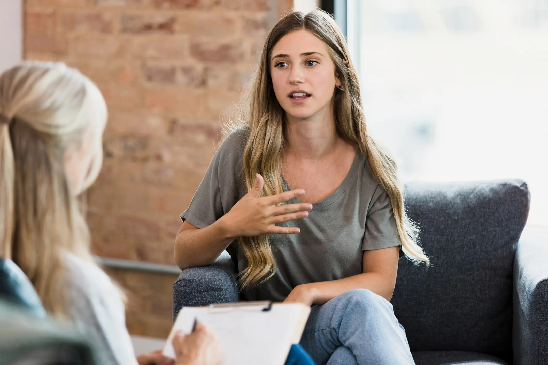 Woman talking during a therapy session.