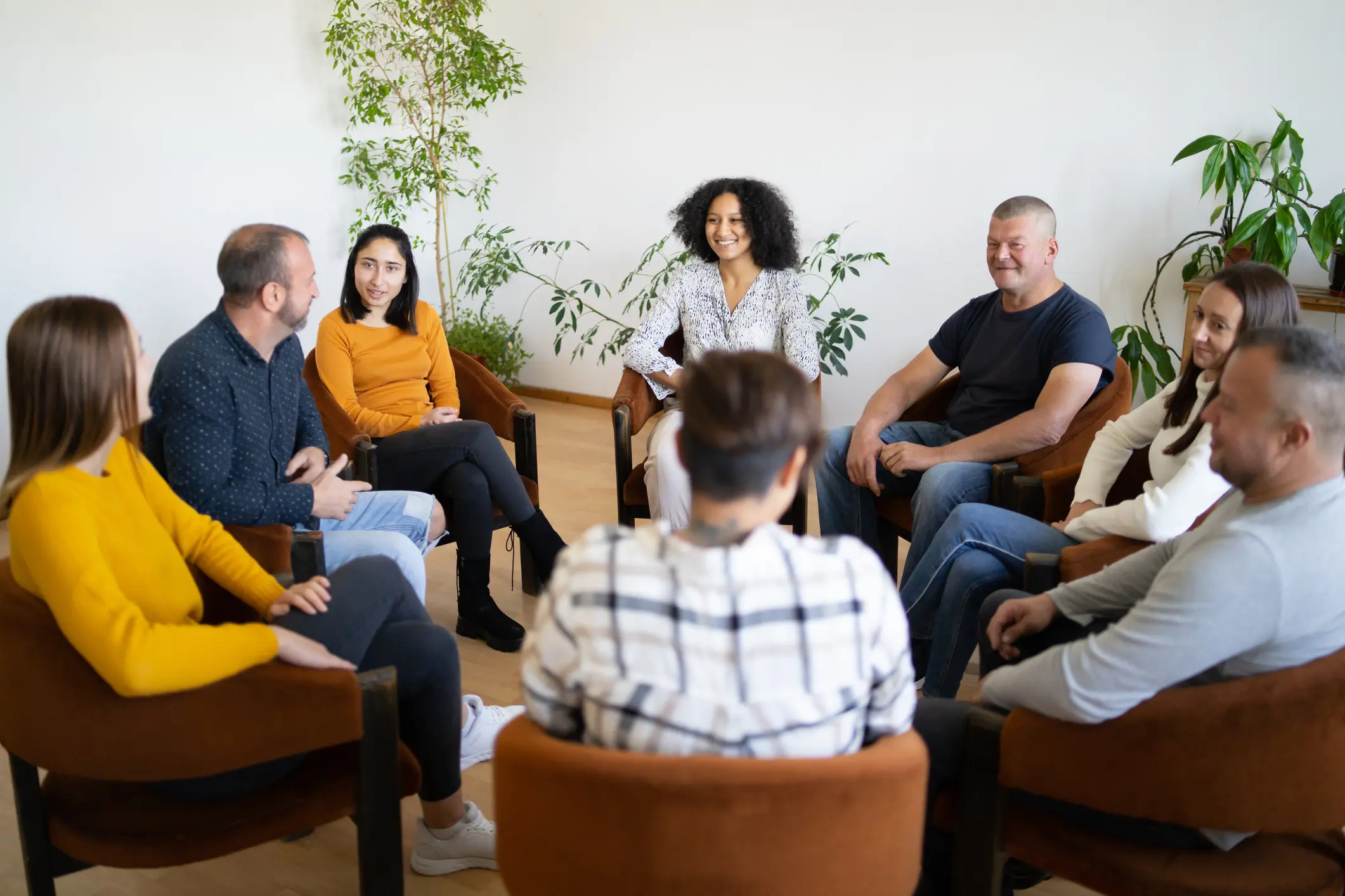 Group discussion in a circle of chairs.