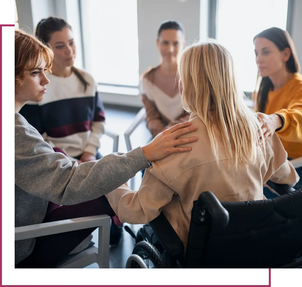Support group sitting in a circle, talking.